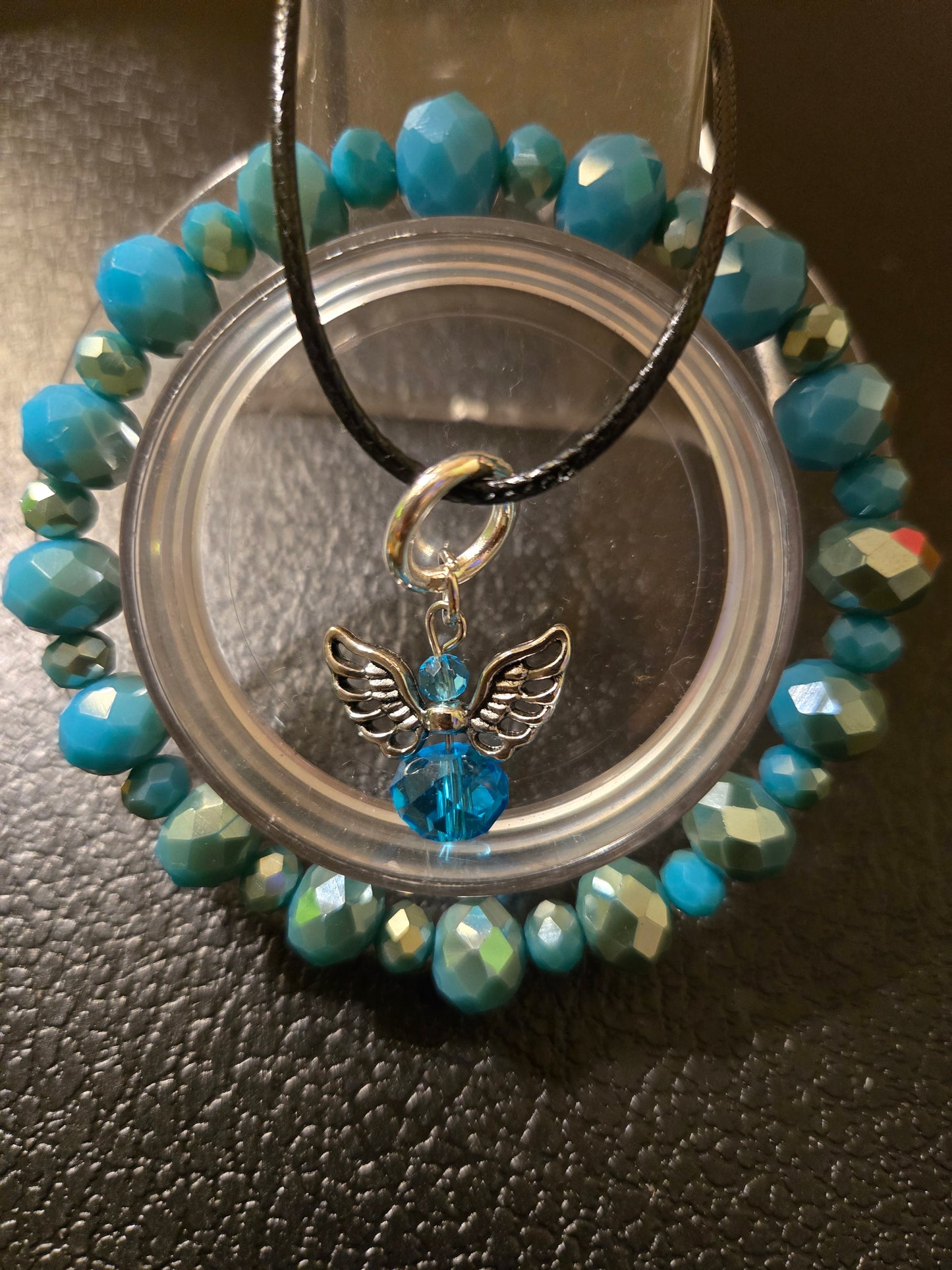 CRYSTAL BRACELET WITH WINGED STONE NECKLACE